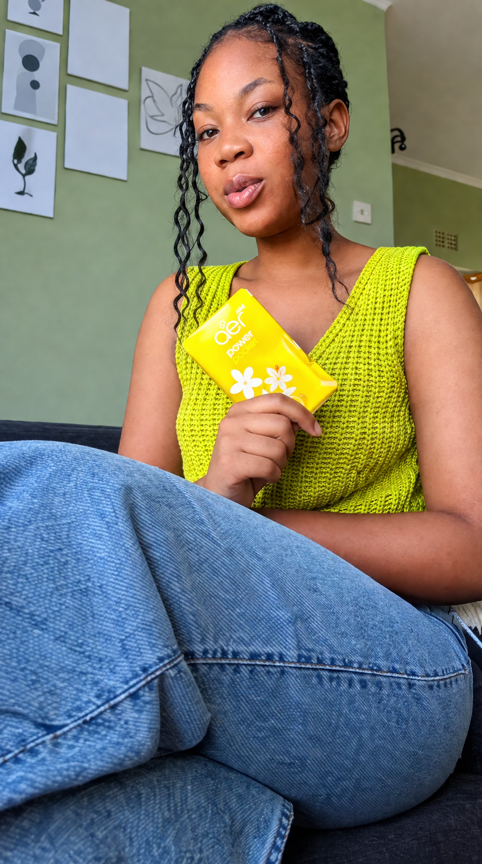 Influencer holding a Jasmine Floral Delight sachet at home