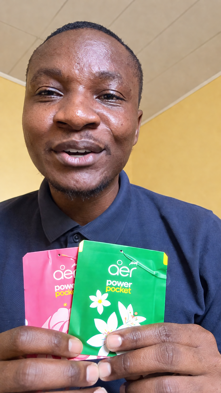 Male influencer holding Fresh Rose Blossom and Jasmine Floral Delight sachets
