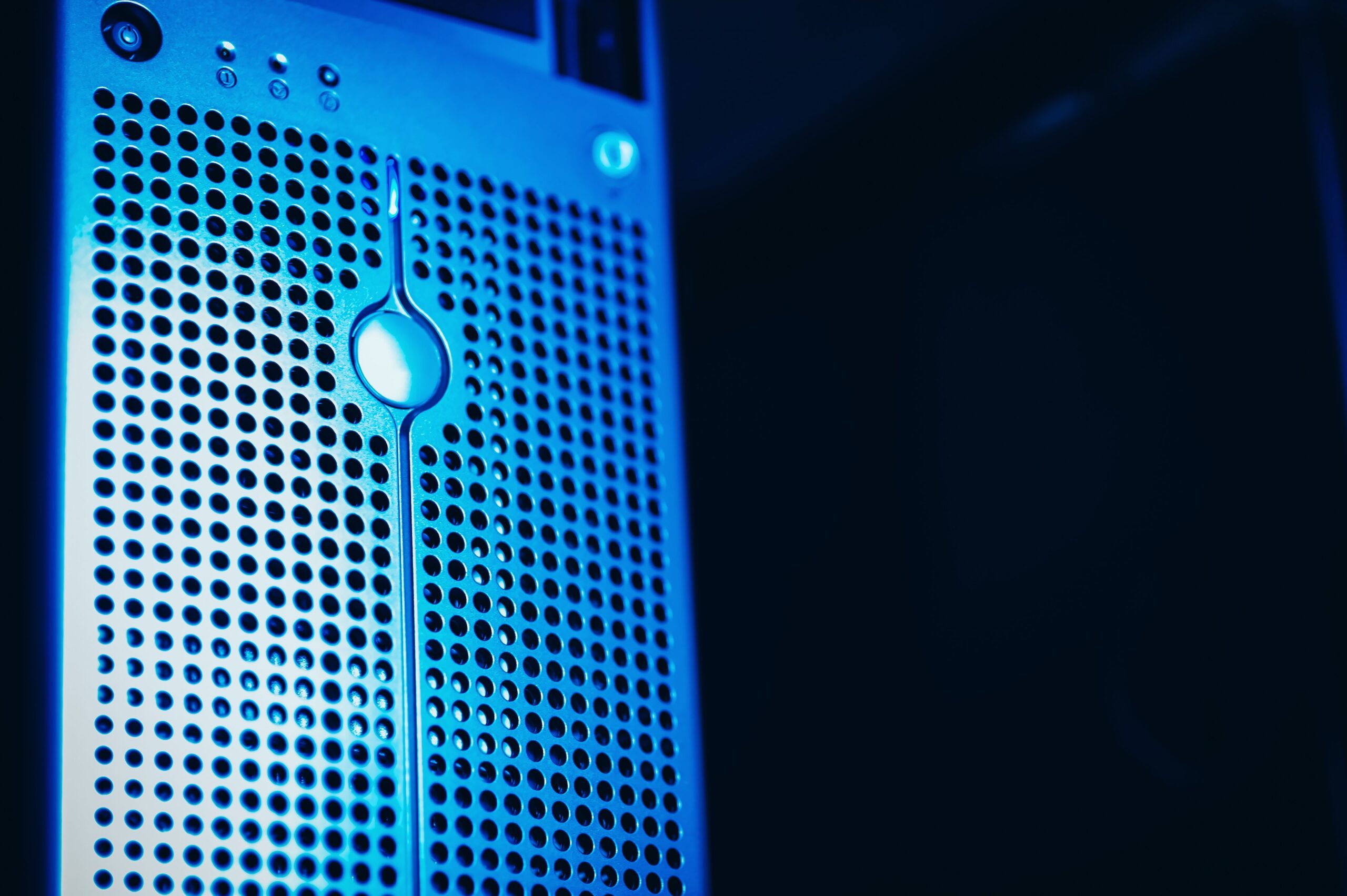 Server rack lit in blue inside a data centre